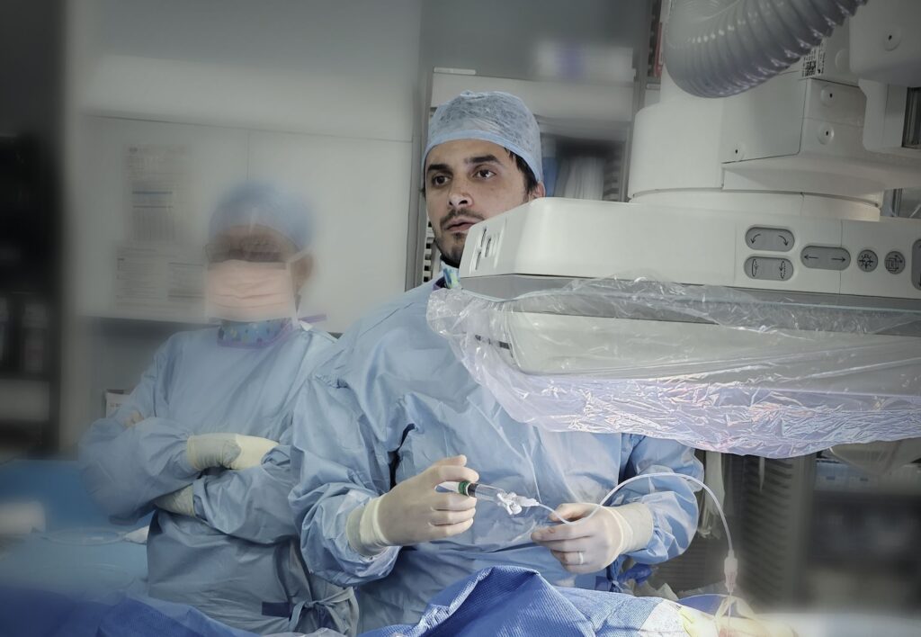 Dr Bayati performing surgery using ultrasound at bayati clinic